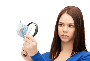 Image showing woman with magnifying glass and euro cash money