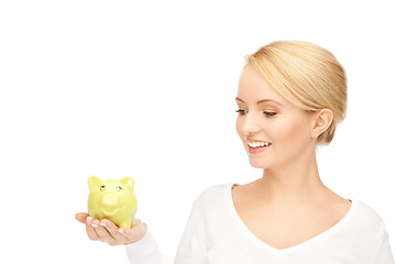 Image showing lovely woman with piggy bank