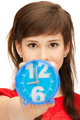 Image showing teenage girl holding alarm clock