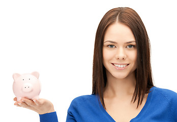 Image showing lovely woman with piggy bank