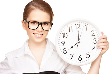 Image showing woman holding big clock