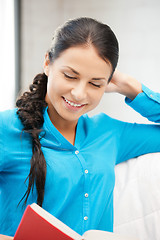 Image showing happy and smiling woman with book