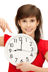 Image showing teenage girl holding big clock