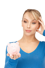 Image showing lovely woman with piggy bank