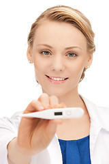 Image showing attractive female doctor with thermometer