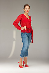 Image showing lovely woman in red blouse and jeans