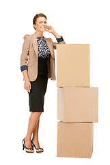 Image showing attractive businesswoman with big boxes