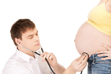 Image showing doctor and pregnant woman belly