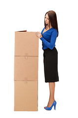 Image showing attractive businesswoman with big boxes