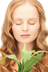 Image showing woman with green sprout