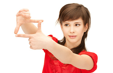 Image showing teenage girl creating a frame with fingers