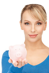 Image showing lovely woman with piggy bank