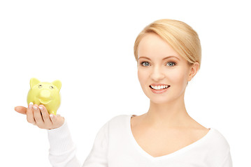 Image showing lovely woman with piggy bank