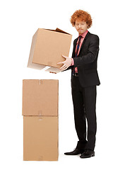 Image showing attractive businessman with big boxes