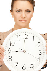 Image showing woman holding big clock