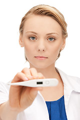 Image showing attractive female doctor with thermometer