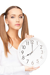 Image showing woman holding big clock