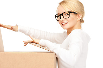 Image showing attractive businesswoman with cardboard box