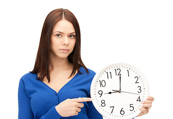 Image showing woman holding big clock