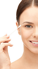 Image showing beautiful woman with cotton bud