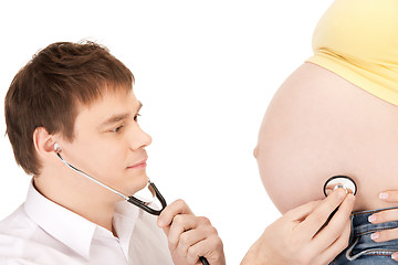 Image showing doctor and pregnant woman belly