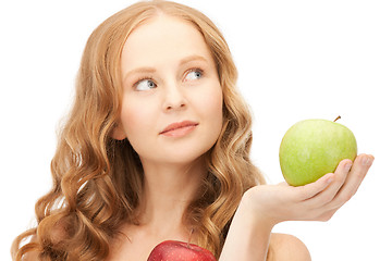 Image showing young beautiful woman with green and red apples