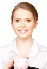 Image showing lovely woman with piggy bank