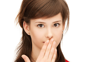 Image showing teenage girl with palms over mouth