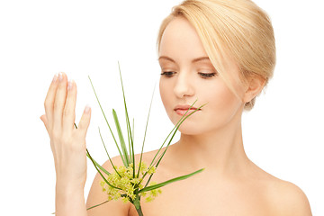 Image showing woman with green sprout