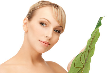 Image showing woman with green leaf