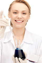 Image showing lab worker holding up test tube