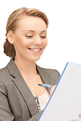 Image showing happy woman with big notepad
