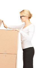 Image showing attractive businesswoman with big boxes