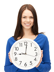 Image showing woman holding big clock