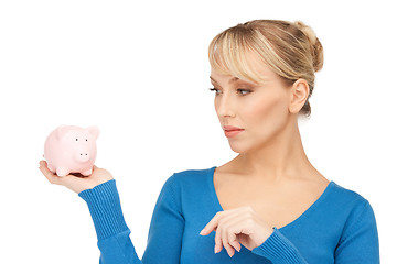 Image showing lovely woman with piggy bank