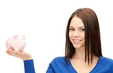 Image showing lovely woman with piggy bank