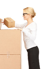 Image showing attractive businesswoman with big boxes