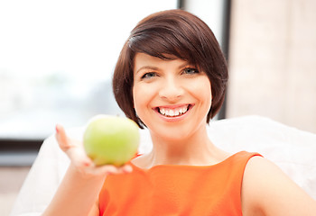 Image showing lovely housewife with green apple