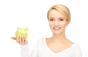 Image showing lovely woman with piggy bank