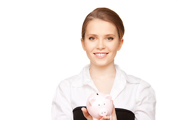 Image showing lovely woman with piggy bank