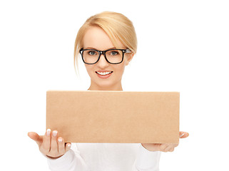 Image showing attractive businesswoman with cardboard box