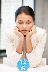 Image showing businesswoman with clock