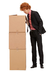 Image showing attractive businessman with big boxes