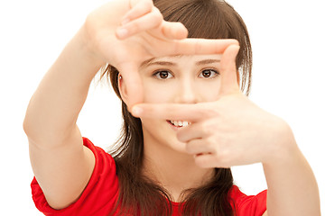 Image showing teenage girl creating a frame with fingers