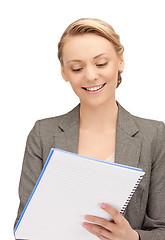 Image showing happy woman with big notepad