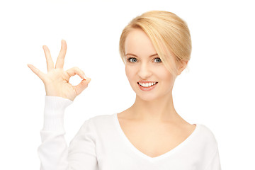 Image showing lovely teenage girl showing ok sign