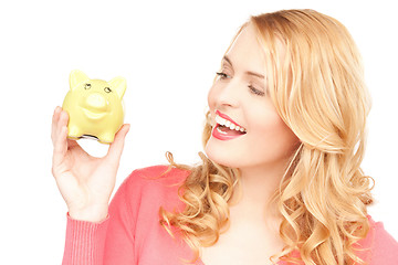 Image showing lovely woman with piggy bank