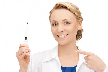 Image showing attractive female doctor with thermometer