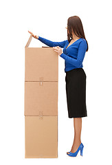 Image showing attractive businesswoman with big boxes