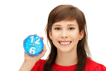 Image showing teenage girl holding alarm clock